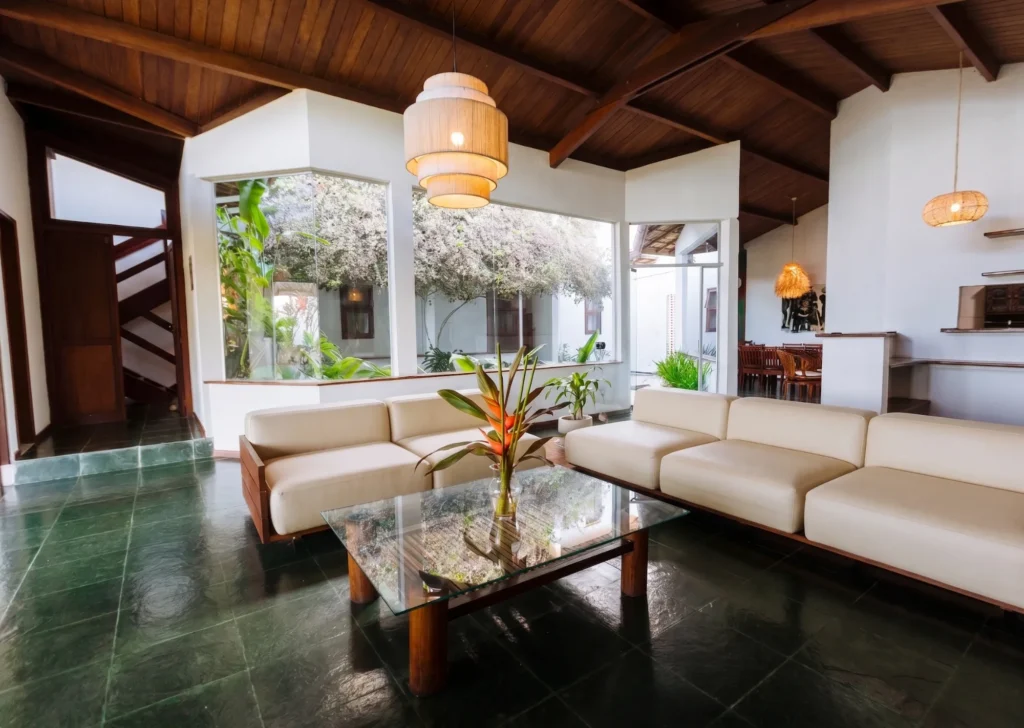 Living room at Azorai Hotel Boutique with sofas and a view of the inner courtyard