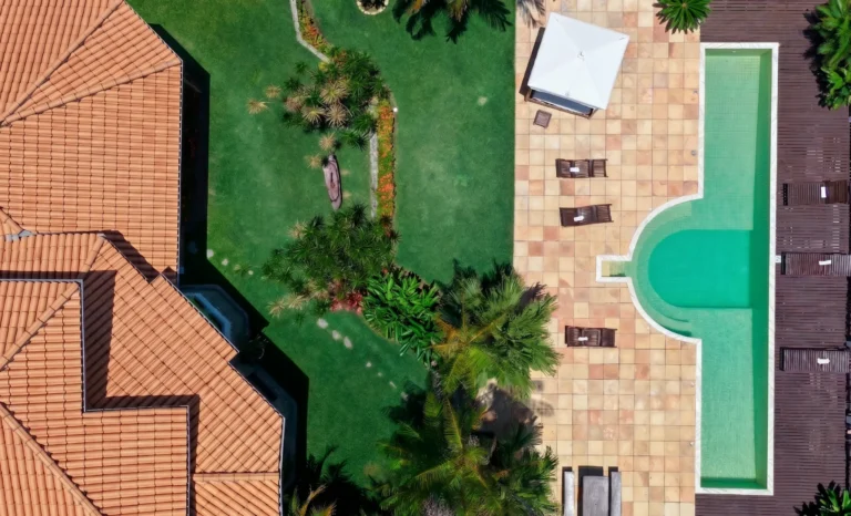 Aerial view of the pool and rooftops of Azorai, a sea-view hotel near Porto Seguro